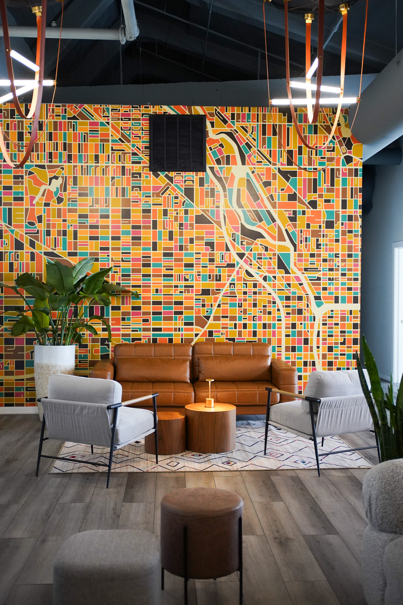 Lounge seating against the Chicago map mural at River North, 320 W. Ohio St