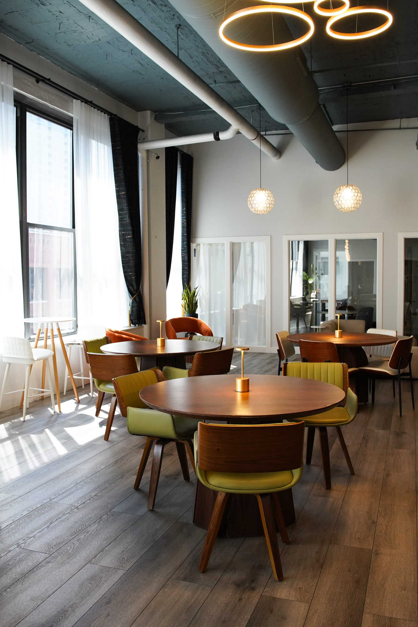 Sunlit dining tables by the windows at River North, 320 W. Ohio St