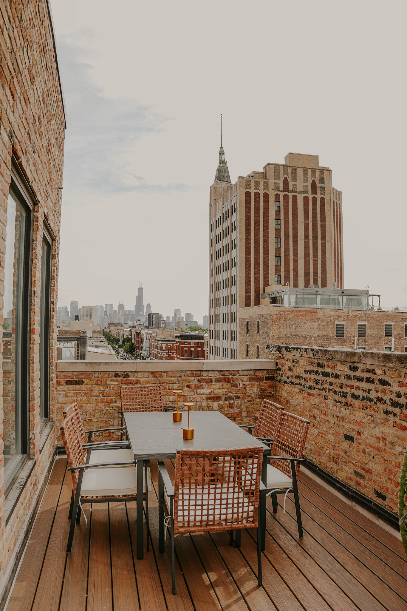 The outdoor terrace at the Wicker Park clubhouse with the Chicago skyline behind