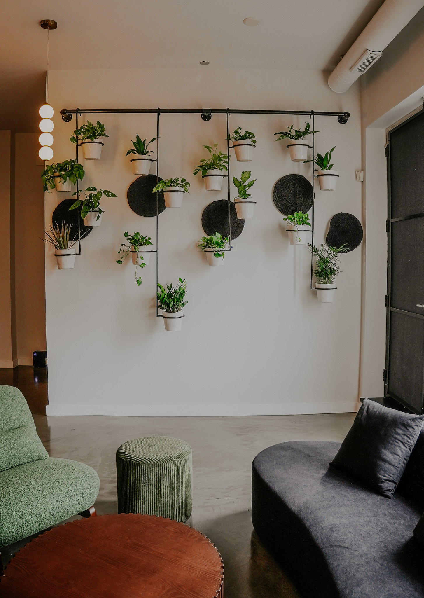 The plant wall lounge at the Wicker Park clubhouse in Chicago