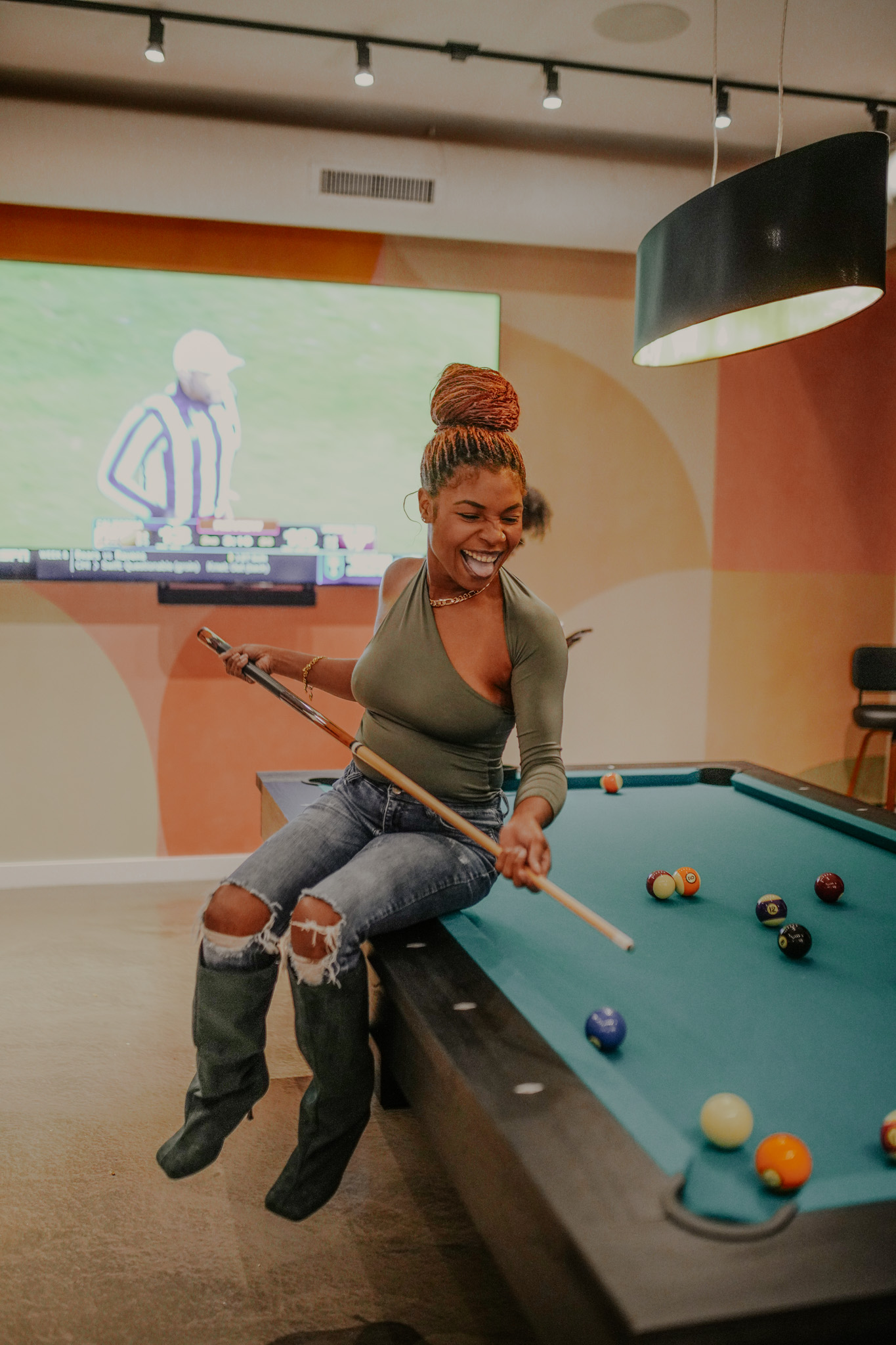 Member laughing at the pool table