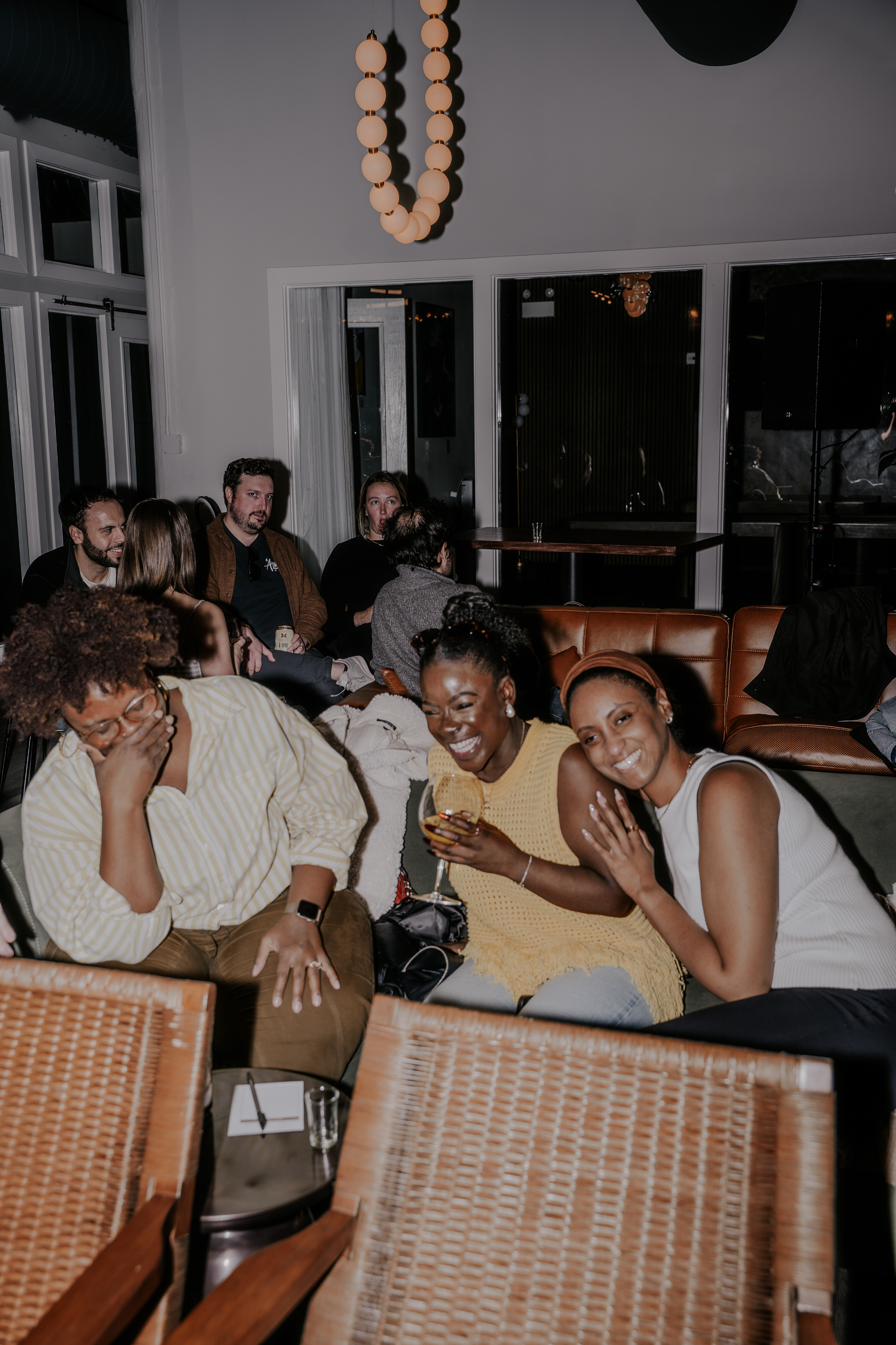 Members laughing on the couch