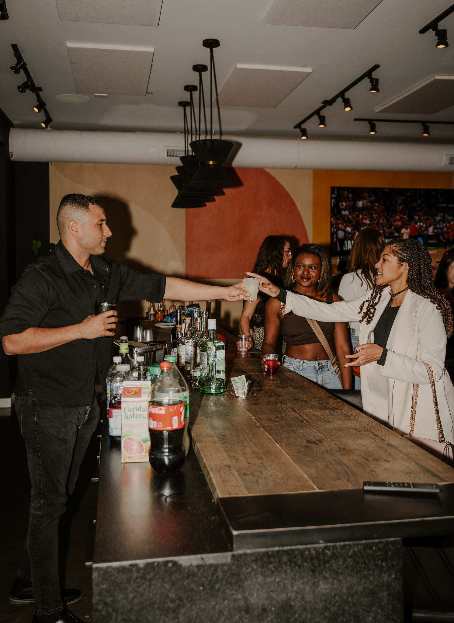 A member ordering a drink at the bar
